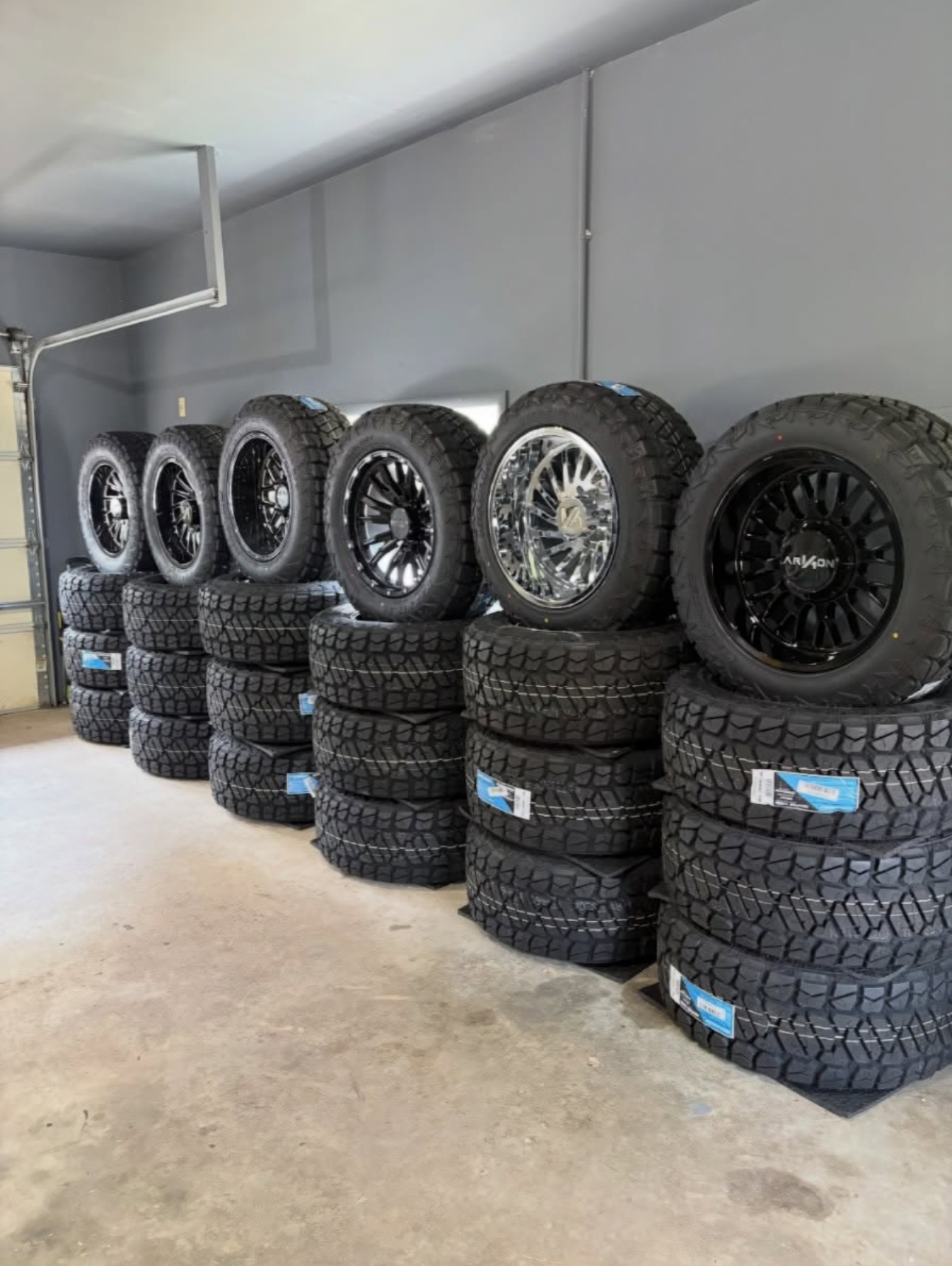Racks of wheel and tire packages in stock at Hideaway Auto