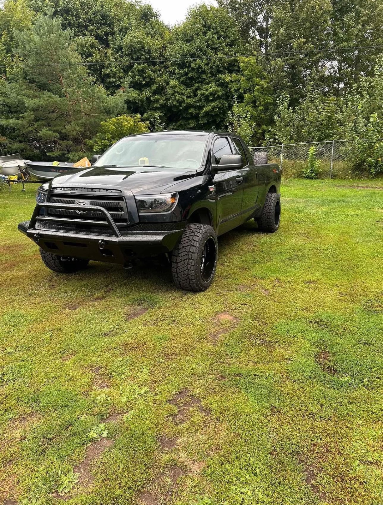 Lifted black Toyota Tundra on aggressive tires